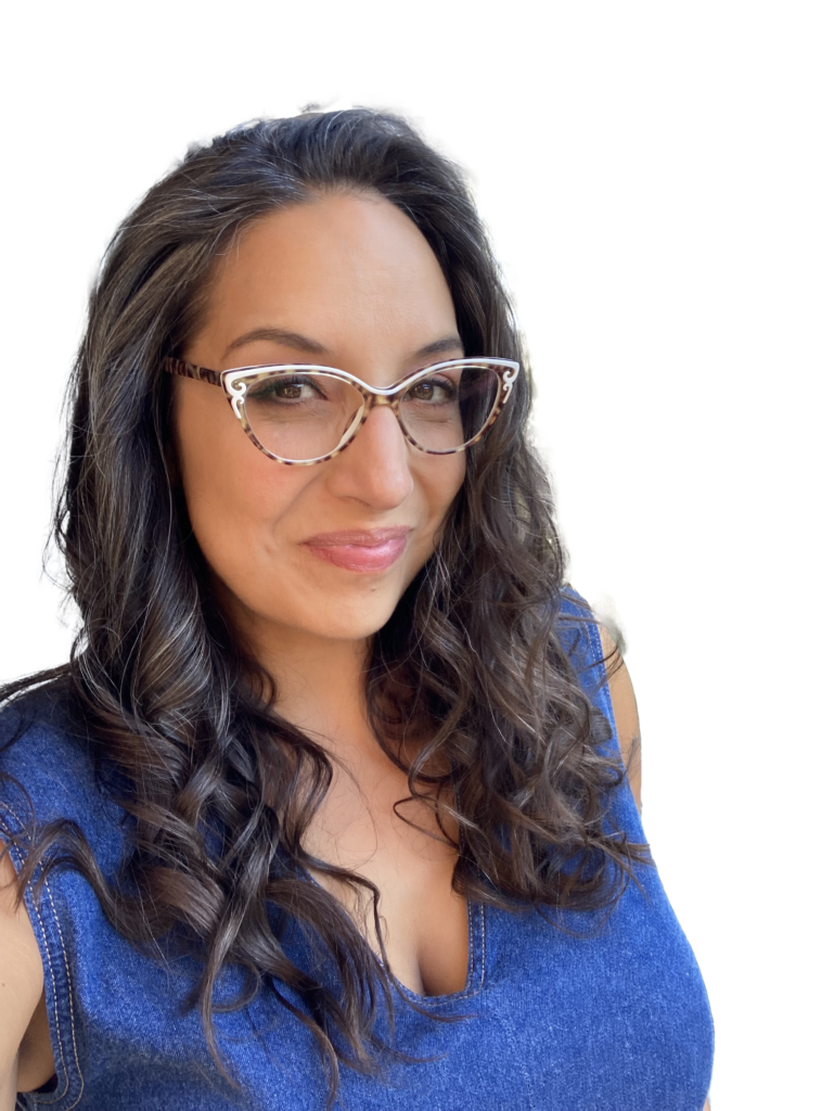 Cutout photo of Michelle Muri, wearing cat eye glasses and a blue top.